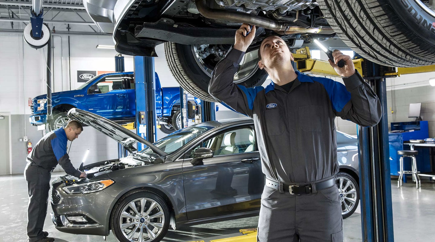 Ford Service Technicians performing service on Ford vehicles